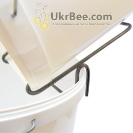 Bucket holder with honey, 